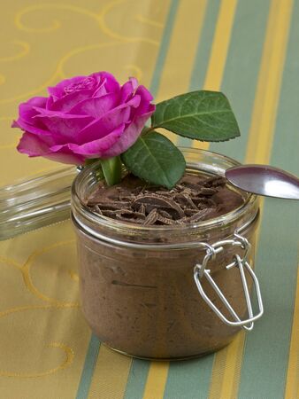 Chocolate pudding with a pink roseの写真素材