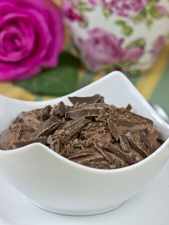 Chocolate pudding with a pink roseの写真素材