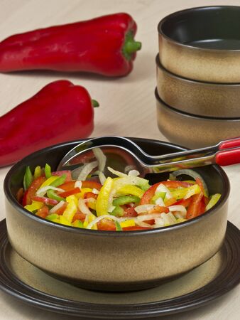 Pepper salad of yellow, red and green peppersの写真素材