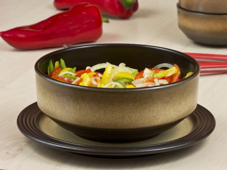 Pepper salad of yellow, red and green peppersの写真素材