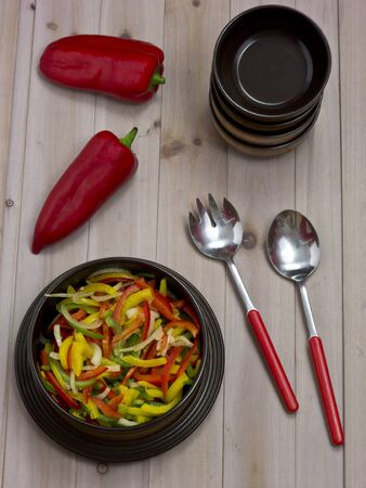 Pepper salad of yellow, red and green peppersの写真素材