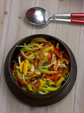 Pepper salad of yellow, red and green peppersの写真素材