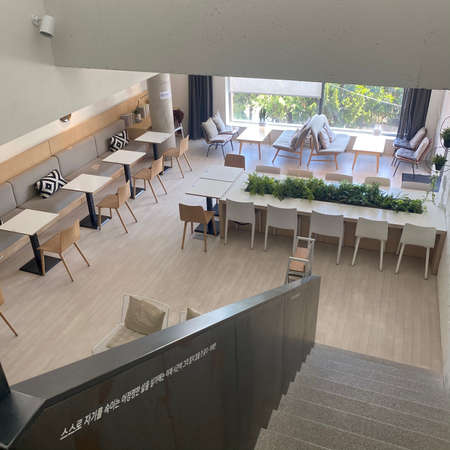 Interior of a modern cafe with tables and chairs. View from above.の写真素材