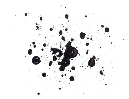 Black splatter paint isolated on white paper backgroundの写真素材