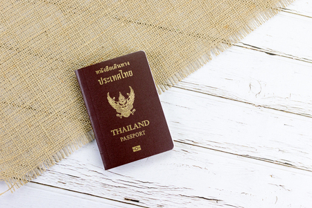 Thai passport on white wood and spinach backgroundの写真素材