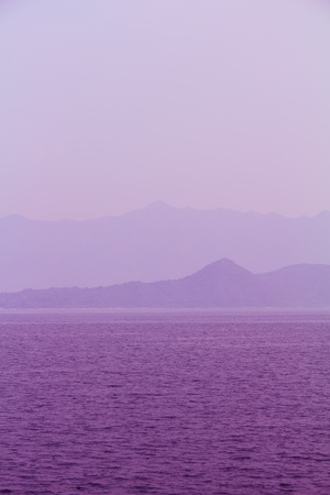 purple sky, sea and hill for a calm zen effectの写真素材