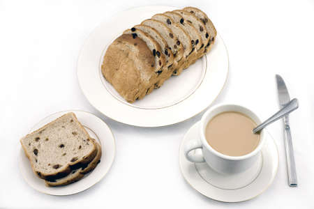 table top with raison bread loaf and coffee.  Photographed in studio.の写真素材