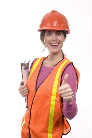 woman wearing a construction outfit giving thumbs up.の写真素材