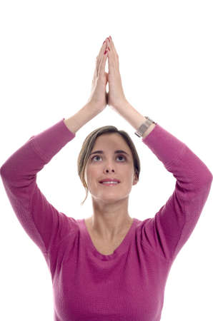 woman in yoga or prayer position photographed in studio.の写真素材