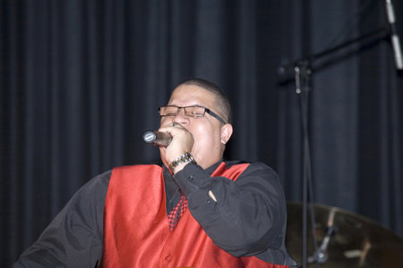 Bronx, NY - April 9: Pentecostal Christian singer Hector Delgado sings during event held at Lehman High School. Taken April 9th, 2011 in the County of the Bronx, NY.のeditorial素材