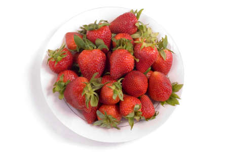 plate of strawberries against a white background.の写真素材