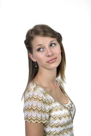 Studio image of girl against a plain background making facial expression.  の写真素材