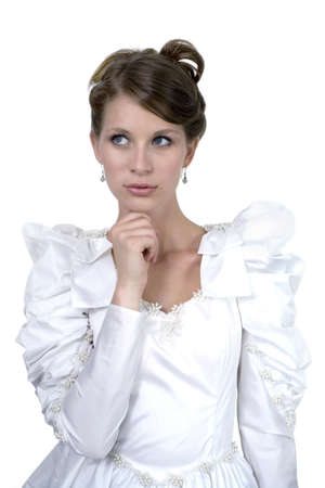 Young girl wears wedding dress.  Photographed in studio.  の写真素材