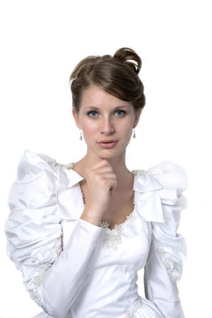 Young girl wears wedding dress.  Photographed in studio.  の写真素材