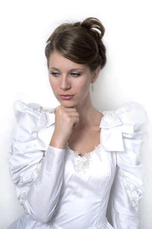 Young girl wears wedding dress.  Photographed in studio.  の写真素材