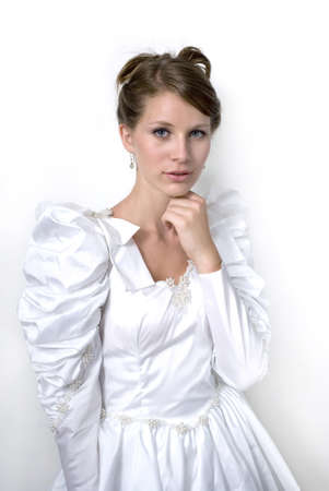 Young girl wears wedding dress.  Photographed in studio.  の写真素材