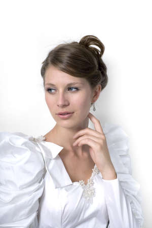 Young girl wears wedding dress.  Photographed in studio. の写真素材