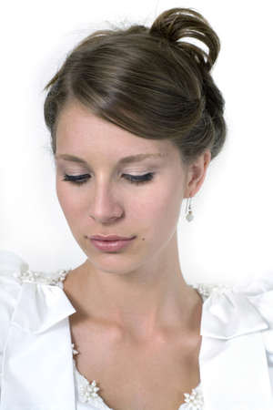 Young girl wears wedding dress.  Photographed in studio.  の写真素材