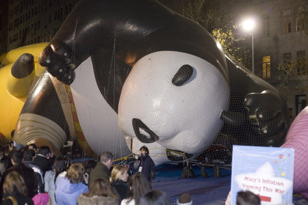 NEW YORK, NEW YORK - NOVEMBER 24: Giant Panda balloon gets inflated the night before the Macyのeditorial素材