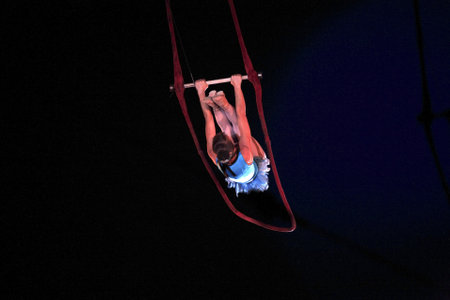 NEW YORK, NEW YORK - NOVEMBER 15: Woman on trapeze performs during Big Apple Circus show.  Taken November 15, 2007 in New York City.のeditorial素材