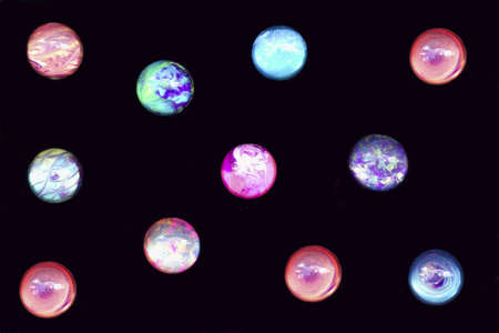 photo of colored plastic balls against a black backgroundの写真素材
