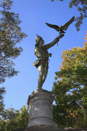 Statue of the Falconer located in Central Park in New York City.の写真素材