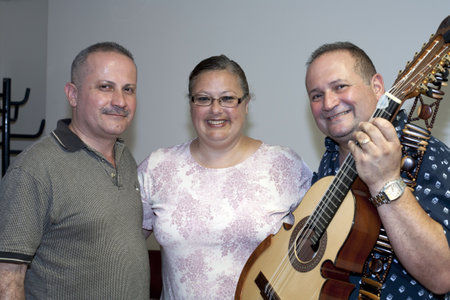 BRONX, NY - June 24: veteran cuatro players Bill and Edwin Colon Zayas stand with Minerva, wife of legendary cuatro player Yomo Toro in the waiting area during their visit to Yomo at Hospital. Yomoのeditorial素材