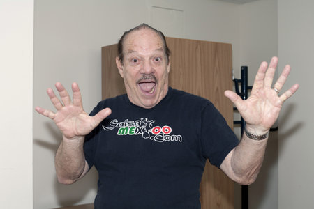 BRONX, NY - June 24:  Larry Harlow takes a moment to lighten the mood before going in to the hospital room to see legendary cuatro player Yomo Toro at Hospital. Yomoのeditorial素材