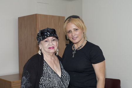 BRONX, NY - June 24:  veteran Bolero singer Blanca Iris Villafane and radio speaker Mayra Roman in a waiting area during their visit to legendary cuatro player Yomo Toro at Hospital. Yomoのeditorial素材