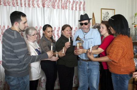 BRONX, NEW YORK - DECEMBER 23: Yomo Toro's family unites in prayer to remember international cuatro player Yomo Toro who was awarded the Grammy but passed away before he could accept it. Taken December 23, 2012 in the Bronx, NY.のeditorial素材