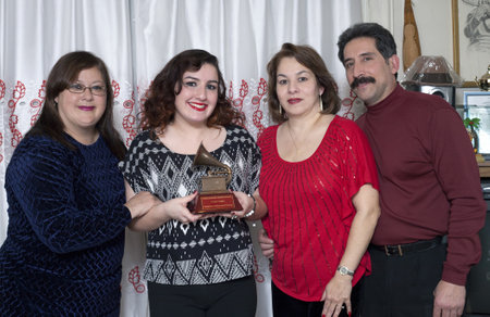 BRONX, NEW YORK - DECEMBER 23: Yomo's wife Minerva, his niece Christina, niece Liz and her husband Andy remember Latin Grammy winner and international cuatro player Yomo Toro who was awarded the Grammy but passed away before he could accept it. Taken Deceのeditorial素材