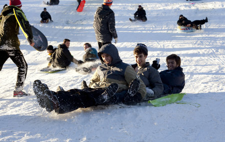 NEW YORK, NEW YORK - FEBRUARY 9:  People enjoy sled riding in Central Park one day after snow storm Nemo. Taken February 9, 2012 in NYC.のeditorial素材