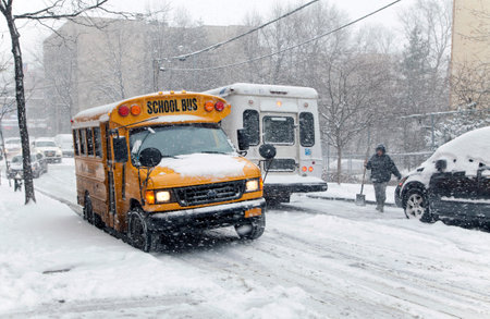 BRONX, NEW YORK - JANUARY 21  A school bus and other traffic during a 6 to 10 inch snow storm with...