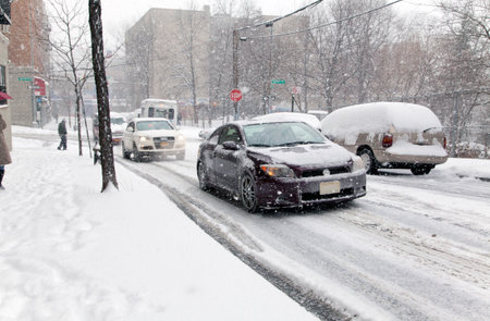 BRONX, NEW YORK - JANUARY 21  Street traffic during a 6 to 10 inch snow storm with teen temperatures along Ogden avenue and 162nd street   Taken January  21,  2014 in the Bronx,  New York のeditorial素材