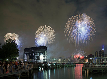 QUEENS, NEW YORK - JULY 4: Macy's independence day firework celebration in NYC as viewed from Gantry Plaza State Park in Long Island City.   Taken July 4, 2015 in Queens, NY.のeditorial素材