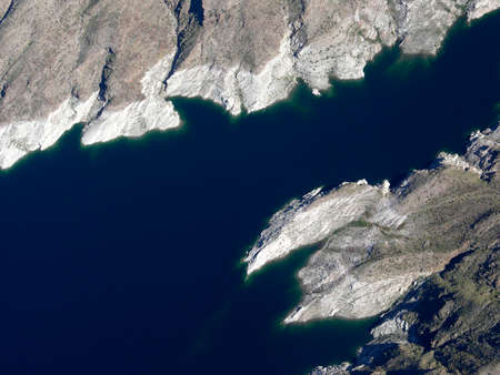 Aerial view of Lake Mead which is located  in the state of Nevada. Formed by water impounded by the Hoover Dam in the USA.の写真素材