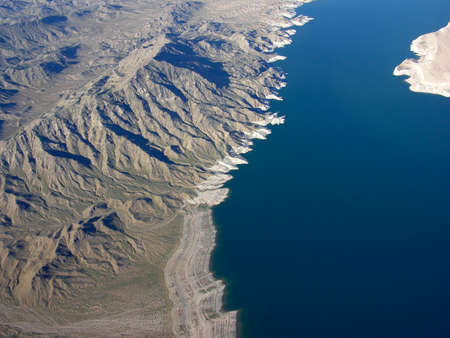 Aerial view of Lake Mead which is located  in the state of Nevada. Formed by water impounded by the Hoover Dam in the USA.の写真素材
