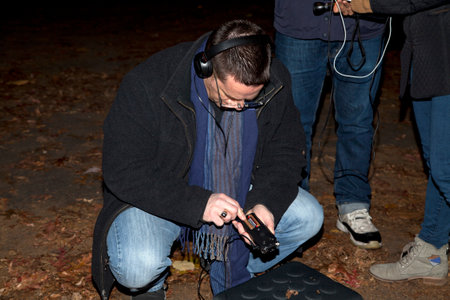 HUNTINGTON, NEW YORK, USA - NOVEMBER 14,  2015: Ron Yacovetti checks his audio recording device  as...