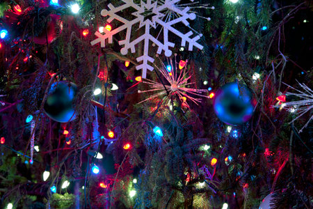 Christmas decorations and lights on a traditional Christmas tree.のeditorial素材