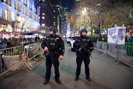 NEW YORK, NEW YORK, USA - DECEMBER 10: Members of the NYPD Police Strategic Response Group stand guard at Christmas time in Herald Square and 34th street.  Taken December 10, 2015 in NY.のeditorial素材