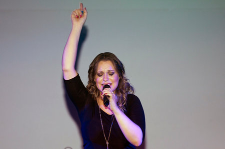 BRONX, NEW YORK - SEPTEMBER 9: Female singer Christine D' Clario performs during a Christian concert at a local high school for Realizing Possibilities ministry.  Taken September 9, 2012 in  New York.のeditorial素材