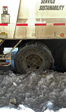 BRONX, NEW YORK - MARCH 14:  Wheel of Sanitation truck with chains.  Taken March 14, 2017 in New...