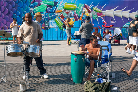 BROOKLYN, NEW YORK, USA - AUGUST 16: Men playing percussion instruments on Coeny Island boardwalk.  Taken August 16, 2017 in New York.のeditorial素材