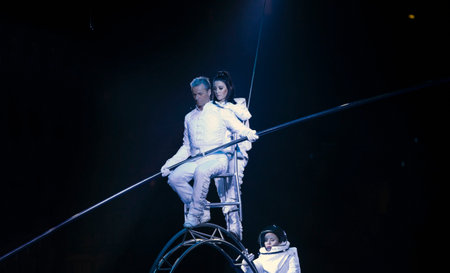 BROOKLYN, NEW YORK - FEBRUARY 25: Laszlo Simet, his partner and wife below  dressed as astronauts  balance on Simet wheel at Barclays during Ringling Bros Barnun Baley Circus.  Taken February 25, 2017 in New York.のeditorial素材