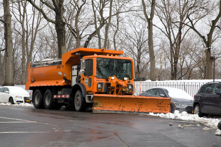 BRONX, NEW YORK/USA - March 2, 2019: A NYC Department of Sanitation vehicle stands by with snow plow and salt.のeditorial素材