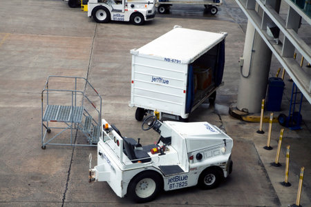 CAROLINA, PUERTO RICO - FEBRUARY 28, 2019:  Jet Blue ground support equipment and vehicle at San Juan airport.のeditorial素材