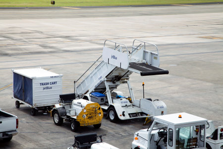 CAROLINA, PUERTO RICO - FEBRUARY 28, 2019: Jet Blue ground support equipment and vehicle San Juan airportのeditorial素材