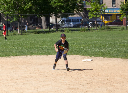 BRONX, NEW YORK/USA - May 21, 2019: Kids from Mott Hall Science Academy play baseball in nearby...