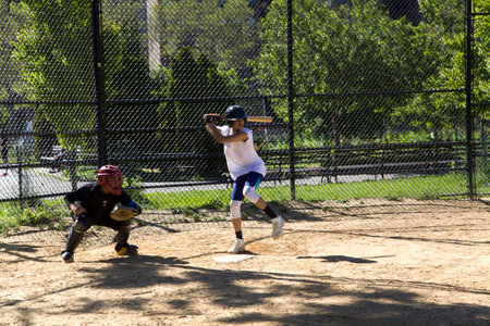 BRONX, NEW YORK/USA - May 21, 2019: Kids from Mott Hall Science Academy play baseball in nearby park.のeditorial素材