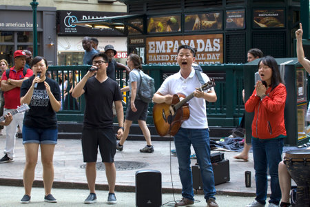 NEW YORK, NEW YORK/USA - July 27, 2019: Members of Church of Jesus sing praise songs during evangelizing event on Herald Square.のeditorial素材